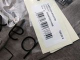 a tag on a t - shirt with a price tag attached to it