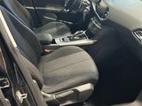 the interior of a car with the door open and the driver ' s seat up