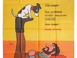 une affiche de film mettant en scène un chien et un homme allongé sur une citrouille