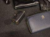 a purse, wallet, and other items on the floor