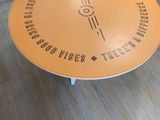 a table with a sign on it in a room