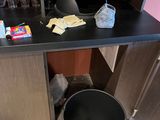 a trash can and a trash can sitting on a counter