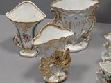 four vases that are sitting on a table