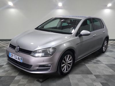 the silver volkswagen golf is parked on a checkered tile floor