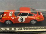 display case with a red porsche 9113s model in it
