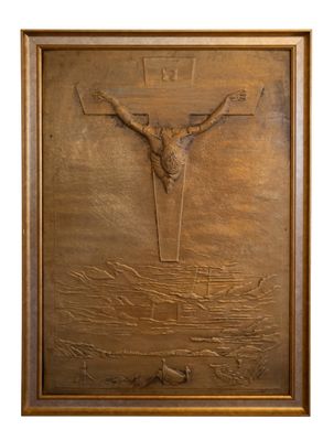 a close up of a metal plaque with a cross on it