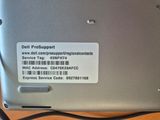 a label on the back of a laptop that says dell