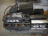a pile of electronics sitting on a pallet in a garage
