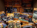 many boxes of legos in a box on the floor