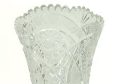a glass vase that is sitting on a table