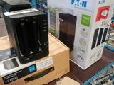 boxes of electronic equipment sit on a shelf in a store