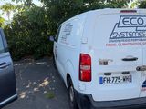 a white van that is parked in a parking lot