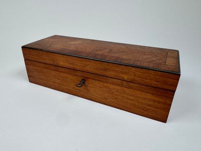 an old wooden box with a handle on a white background