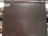an image of a stainless steel refrigerator in a warehouse