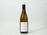 a bottle of wine that is sitting on a table