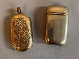 two lighters that are sitting on a table