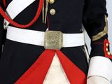 a man in a military uniform with a red and white sash