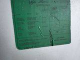 a green label on the side of a white refrigerator
