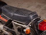 a close up of a motorcycle parked in a garage