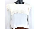 white blouse with ruffles on the neck and long sleeves