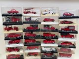 a lot of red toy cars in a display case