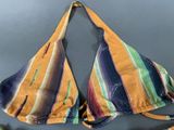 an image of a woman ' s bikini top with colorful stripes on it
