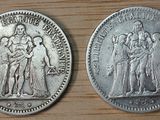 two silver coins with the image of a woman and a man on them
