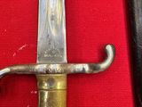 a knife that is laying on a red cloth