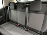 the back seats of a car with two rows of seats in it