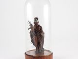 an image of a statue of a woman in a glass dome