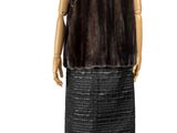 the mannequin is wearing a black skirt and a brown fur vest