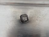 a close up of a piece of metal on a table