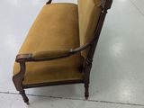 an image of a chair in a room with chairs in the background