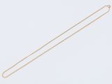 a gold necklace with a chain that is attached to it