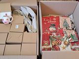two boxes of christmas cards and a cup of coffee on the table