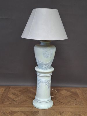 a lamp that is sitting on a wooden floor