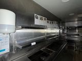 an image of a commercial kitchen with stainless steel appliances