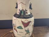 a lamp that is sitting on a table with a rope