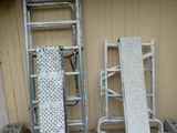 two ladders and a ramp in front of a building