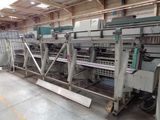 a machine that is working on a machine that is in a warehouse