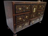 an image of a wooden chest of drawers with many drawers on it