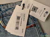 a close up of a tag on a pair of jeans