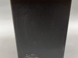 a close up of a wooden table with a black base