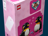 a pink box with a penguin and a penguin on it