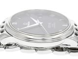 a close up of a watch with a chain around it
