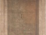 an old photo of a door in a stone building