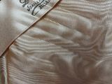 an image of a close up of a dress with a label on it