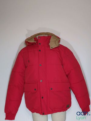 jacket on a mannequin dummy with a red coat on it