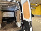 a white van that is parked inside of a building