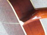 a close up of a guitar on a table